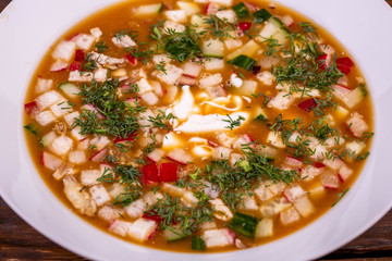 Okroshka with sour cream on kvass with greens