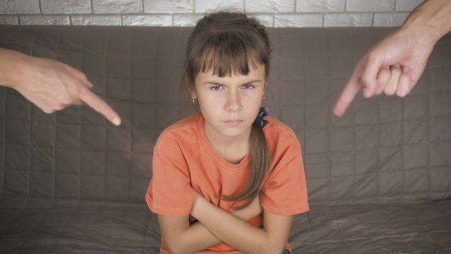Raising a teenager. Sad teenager girl who is scolded by her parents. Problems in adolescence.