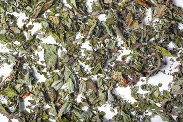Leaves dry tea on a white background. Close up of tea. Top view