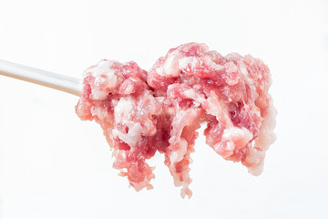 A spoonful of appetizing fresh pork puree / minced meat
