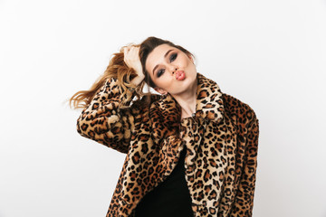 Beautiful young woman wearing leopard coat