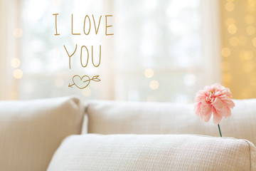 I Love You message with a flower in a bright interior room sofa