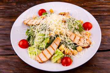 Chicken fillet salad with lettuce leaves and tomatoes of cherry with croutons