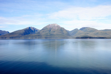 Beautiful Lake In Alaska Surrounded By Mountains And Forests