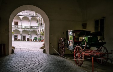 Fototapeta na wymiar carriage in old castle