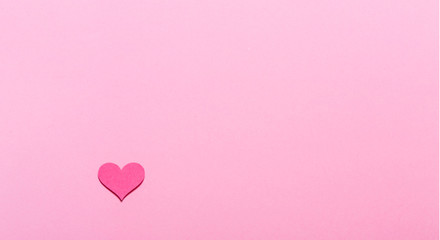 Pink heart on a pink paper background