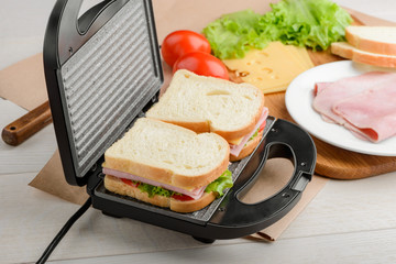 Uncooked sandwiches in panini press