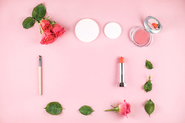 Obraz na płótnie Canvas Flat lay composition with lipstick, blush, flowers.