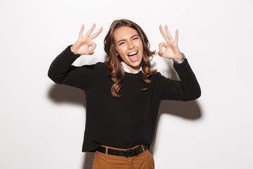 Beautiful amazing happy emotional woman posing isolated showing okay.