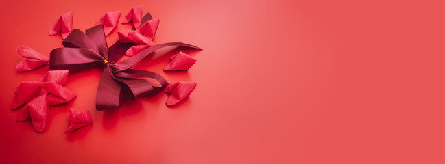 facebook cover and web banner design and decoration for love object in valentine's day concept from flat lay and minimal red paper heart and wedding ring decorate in red background