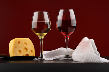 Glass of red and white wine with cheese