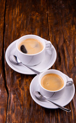Two cups of coffee with milk