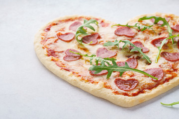 Heart shaped pizza with pepperoni for Valentines day.