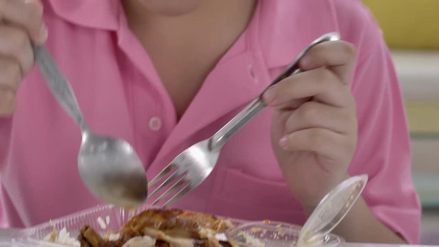 4K asian boy eating lunch at home , Food for lunch, lunchboxes with jasmine rice box.