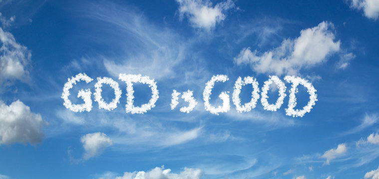 GOD is GOOD inscription painted with clouds on a blue background with white clouds © Pawel Horazy