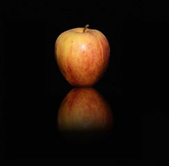 Gala apple and its reflection