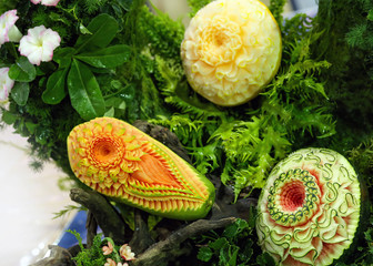 Fototapeta na wymiar Fruit and vegetable carvings, Display thai fruit carving