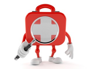 First aid kit character looking through magnifying glass