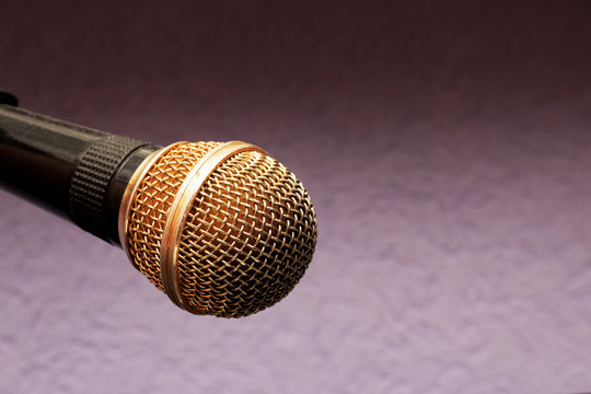 Microphone on a purple background close up