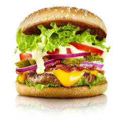 Delicious burger containing cheese, bacon, onion, cucumbers, tomatoes and lettuce, isolated on white background