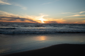 Fototapeta na wymiar sunset beach sand sea reflection