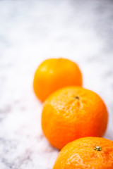 Fruits on the snow, mandarines, apples, pear