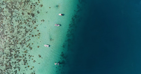  boat in a lagoon in aerial view, Papeete French Polynesia