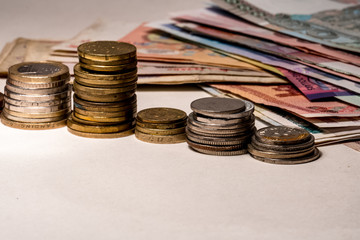 coins and calculator on white background