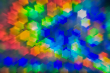 Bokeh, abstract colorful background of defocused hexagon stars. Festive lights and flicker