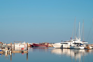 Fototapeta na wymiar Beautiful and luxuous boats in a marina, vacation background for sea lovers.