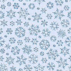 Seamless embroidery snowflakes background.
