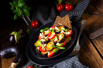 Eggplant grilled with aromatic feta cheese and tomatoes