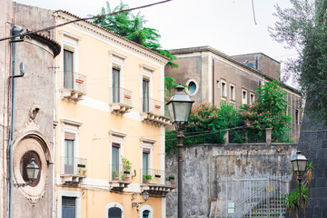 Travel to Italy -  historical street of Catania, Sicily, facade of ancient buildings.