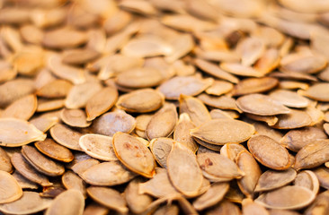 Pumpkin seeds without Husk close up – copy space for text.