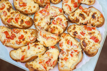 sandwiches with melted cheese and tomatoes
