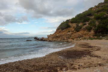 Fototapeta na wymiar Cove in San Antonio de Ibiza a cloudy day