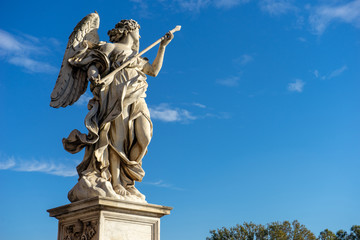 Fototapeta na wymiar Bernini's marble statue of angel from the Sant'Angelo Bridge in Rome, Italy