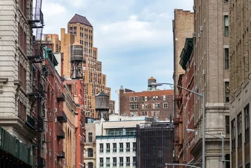  View of the old buildings and water towers in the Tribeca neighborhood of Manhattan, New York City © deberarr