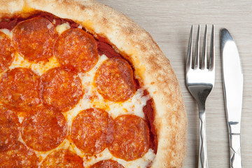 fresh hot pepperoni pizza with sausage
