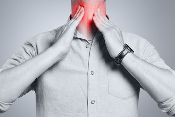 Man touching his neck, having a throat irritation