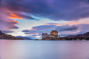 Fototapeta na wymiar Eilean Donan Castle in The Highlands of Scotland on the way to the Isle of Skye - sunset scenery