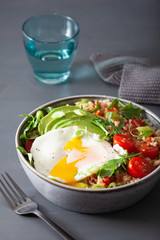 quinoa bowl with fried egg, avocado, tomato, rocket. Healthy vegetarian lunch