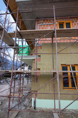 insulation being put on the wall