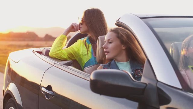 Woman in a convertible car