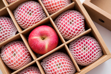 red apples in paper box