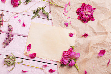 dried flowers on pink wooden background