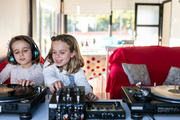 Fototapeta na wymiar Little kids get a party with vinyl records