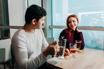Romantic couple dating in pub at night