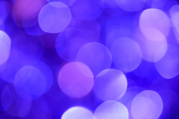 Bokeh. Holiday background. Christmas lights. Glitter. Defocused sparkles. New Year backdrop. Festive wallpaper. Blinks. Carnival. Tinsel. Bokeh retro style photo.