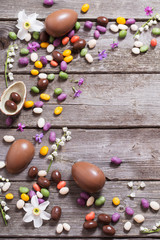 chocolate eggs on old wooden background